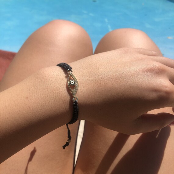 little dolphin evil eye on macrame cord little dolphin evil eye on macrame cord