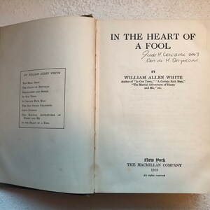 May include: A vintage book titled "In the Heart of a Fool" by William Allen White. The book was published in 1919 by The Macmillan Company in New York.