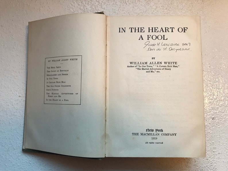 May include: A vintage book titled "In the Heart of a Fool" by William Allen White. The book was published in 1919 by The Macmillan Company in New York.