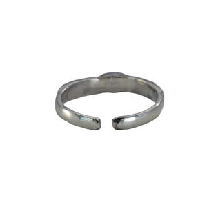 May include: A silver-colored adjustable ring with a simple design. The ring has a slightly textured surface and an open design, allowing for size adjustment. The ring is set against a white background.