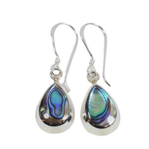 May include: A pair of silver drop earrings featuring teardrop-shaped abalone shell inlays. The shell displays iridescent blue, green, and purple hues.