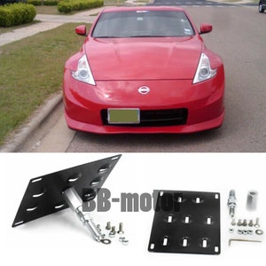 May include: Black metal license plate bracket with mounting hardware. The bracket is designed to fit a Nissan 350Z.