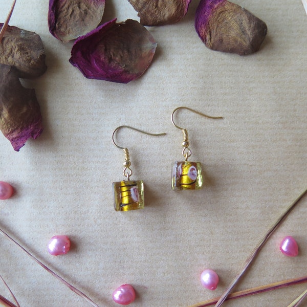 Amber glass earrings with pink flowers