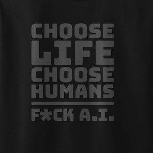 May include: A black short-sleeved t-shirt featuring dark grey block lettering that reads CHOOSE LIFE CHOOSE HUMANS F*CK A.I. The text is centred on the chest area of the shirt, which has a crew neckline and a standard fit design.
