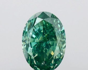 May include: A vibrant green oval-shaped gemstone with a faceted cut. The gem has a bright, almost electric green colour.