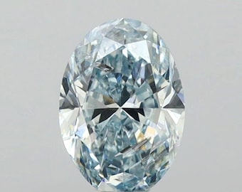 May include: A light blue oval-shaped diamond with a faceted cut. The diamond is set against a white background.