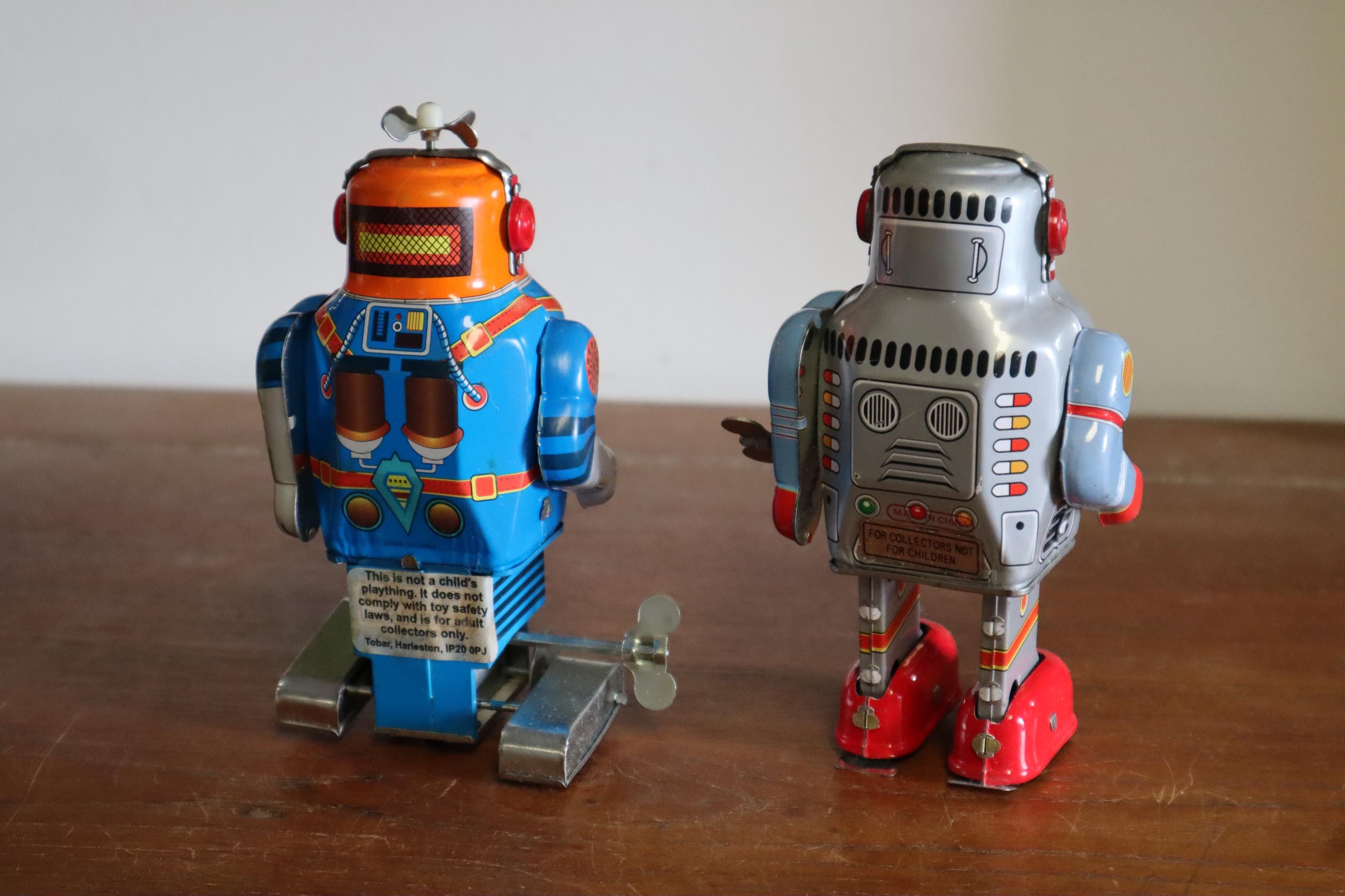 1990's Pair of Tinplate Clockwork Robots - JMT54 Astronaut and