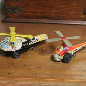 c1950&#39;s Pair of Tinplate Toy Helicopters with Working Friction Power Propellers - Made in England