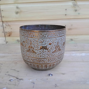 May include: A set of three ceramic mugs with a speckled, matte finish in cream, light grey, and dark grey. Each mug has a simple, minimalist design, suitable for coffee or tea.