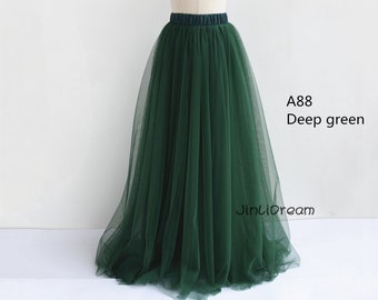 May include: A deep green tulle skirt with a wide waistband. The skirt is on a white mannequin. The text "A88 Deep green" is visible on the right side of the image.