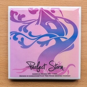 May include: Square coaster with a pink and purple tree design, with the words "Perfect Storm" in a script font. The coaster is labeled "American Double IPA - 1 Pint" and is from Tree House Brewing Company in Massachusetts.