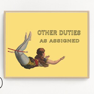May include: A framed print with a yellow background features a vintage illustration of a woman in a circus costume. The text "OTHER DUTIES AS ASSIGNED" is displayed above the woman. The woman is holding a red pole.