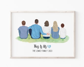 May include: A framed print featuring a family of five sitting on grass, viewed from the back. The family members are wearing blue, white, and light brown clothing. The text "This Is Us" and "THE LEWIS FAMILY 2023" are below the family illustration.
