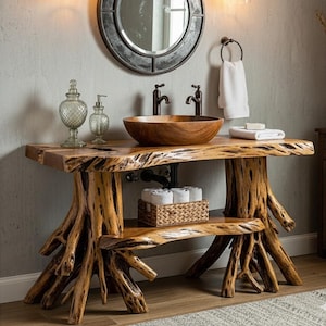 May include: A rustic bathroom vanity with a live-edge wooden countertop and a wooden bowl sink. The base is crafted from natural tree roots, and a lower shelf provides storage. A round mirror and bronze fixtures complete the design.