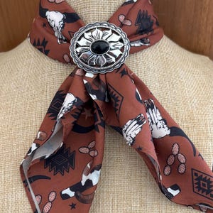 Silver Scarf Slide -Bandana slide- Floral with rope outer edge Silver with black stone at center.