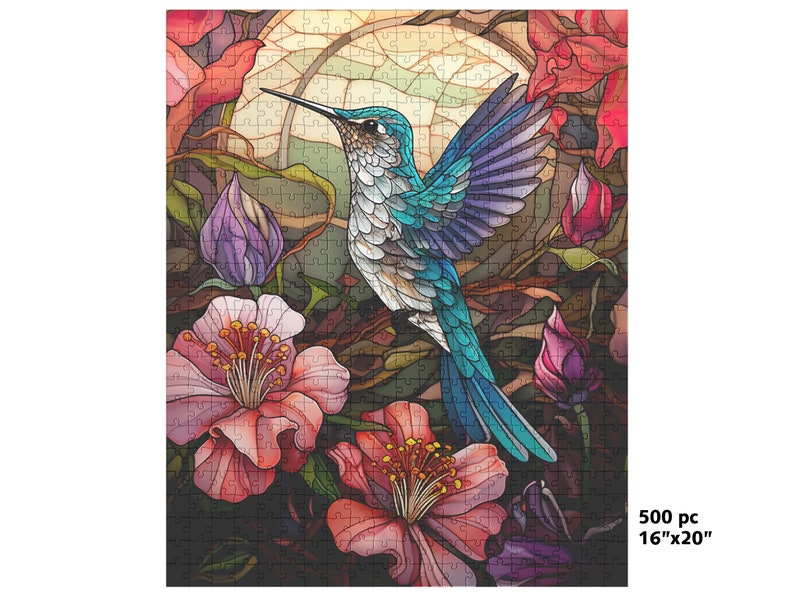 May include: A 500-piece jigsaw puzzle featuring a vibrant illustration of a hummingbird with turquoise and blue feathers, surrounded by pink and red flowers. The puzzle measures 16 inches by 20 inches.