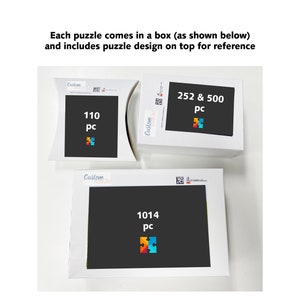 May include: Three white puzzle boxes with black backgrounds and colorful puzzle piece designs. The boxes display the number of pieces: 110, 252 & 500, and 1014. Text on the boxes reads "Each puzzle comes in a box (as shown below) and includes puzzle design on top for reference."