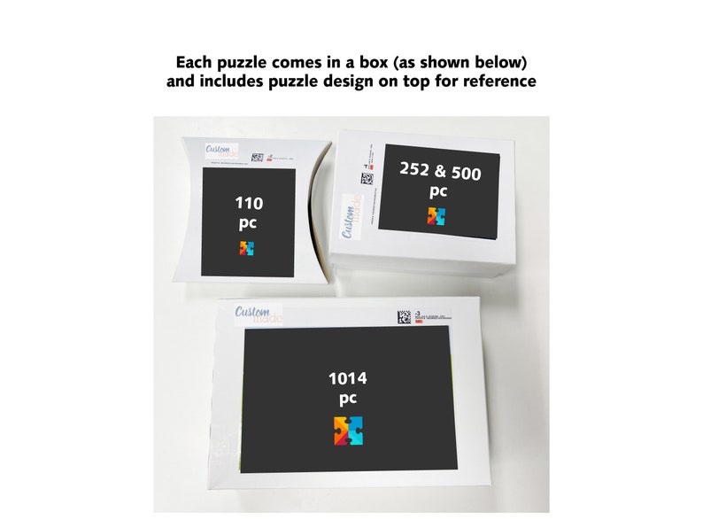 May include: Three white puzzle boxes with black backgrounds and colorful puzzle piece designs. The boxes display the number of pieces: 110, 252 & 500, and 1014. Text on the boxes reads "Each puzzle comes in a box (as shown below) and includes puzzle design on top for reference."
