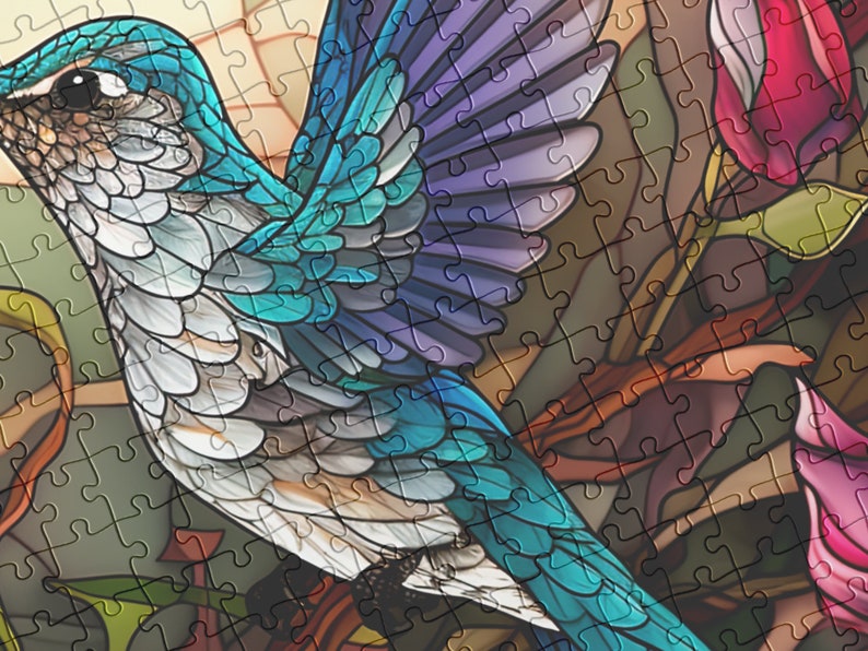 May include: A completed jigsaw puzzle featuring a vibrant hummingbird with blue, teal, and white feathers. The bird is set against a backdrop of stylized flowers in shades of pink and red. The puzzle pieces are visible, creating a stained-glass effect.