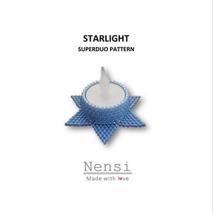 May include: A blue beaded star-shaped candle holder with a white centre and a small white candle. The text "STARLIGHT SUPERDUO PATTERN" is above the candle holder and the text "Nensi Made with love" is below the candle holder.