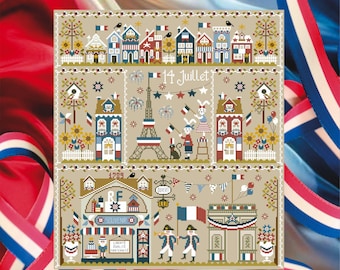 Puede incluir: Un diseño de punto de cruz con escenas francesas, incluyendo la Torre Eiffel y edificios con banderas francesas. El texto "14 Juillet" se muestra, junto con otros elementos de temática francesa. El diseño está sobre un fondo beige con cintas rojas, blancas y azules.