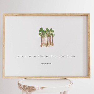 May include: A framed print with a watercolor illustration of trees and the text "Let all the trees of the forest sing for joy. Psalm 96:12"