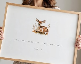 May include: A framed print featuring a watercolour illustration of a fawn lying down in a field of grass. The print includes the text "Be strong and let your heart take courage. Psalm 27:14" printed below the illustration.