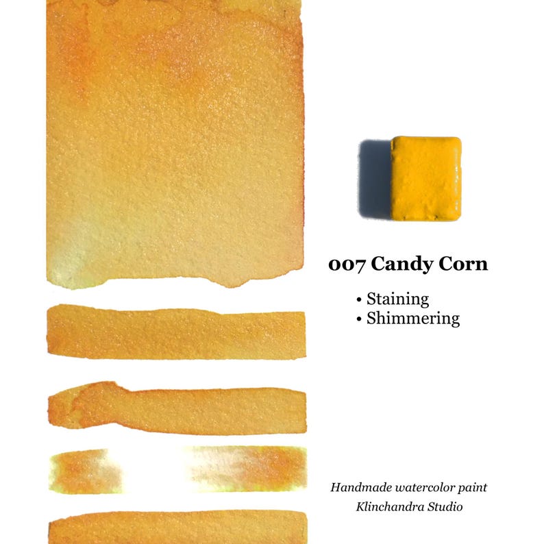 May include: A swatch of Candy Corn watercolor paint, a bright yellow with a shimmery finish. The paint is handmade by Klinchandra Studio. The swatch shows the paint's staining and shimmering qualities.