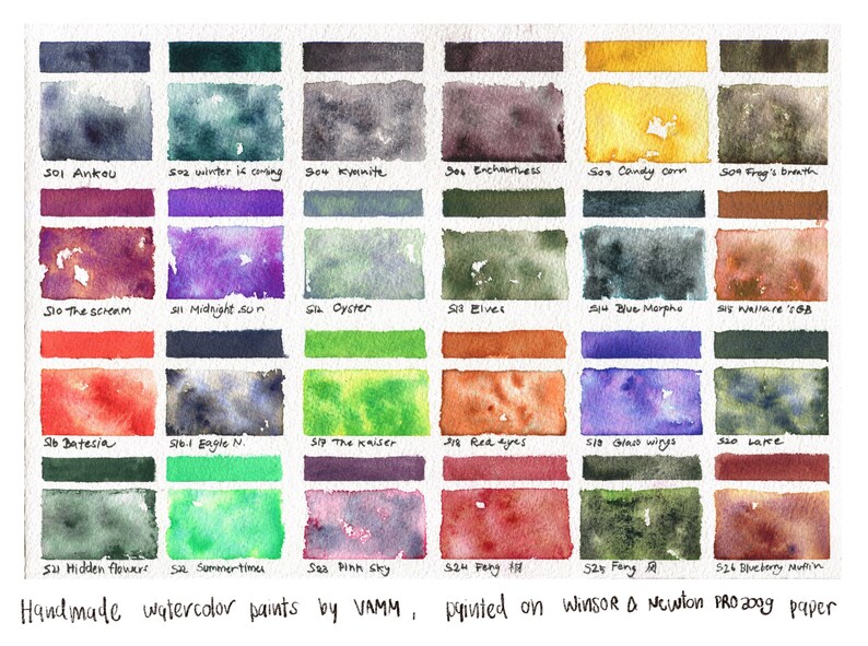 May include: A watercolor paint swatch chart with 24 different colors. The colors are labeled with names like "Ankou", "Midnight Sun", "The Kaiser", and "Blueberry Muffin". The chart is handmade and painted on Winsor & Newton Pro 200g paper.