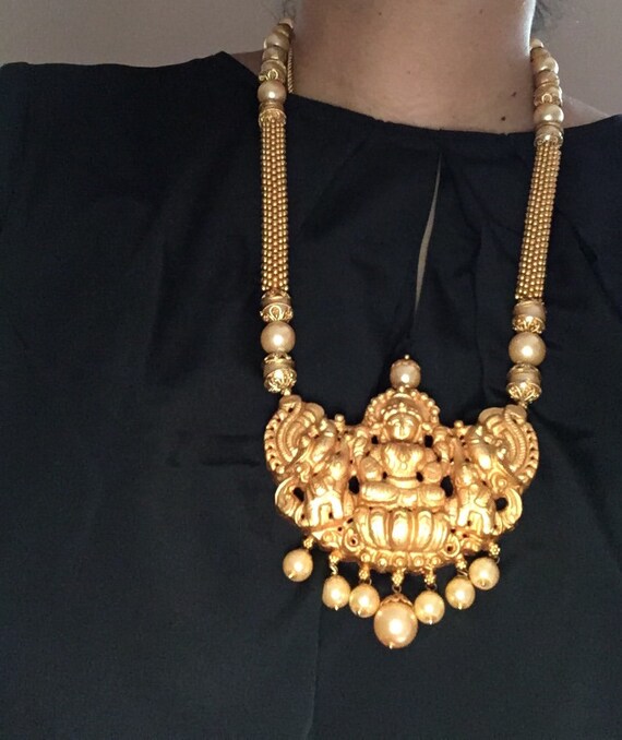 Gaja Lakshmi Pendant With Faux Pearl 