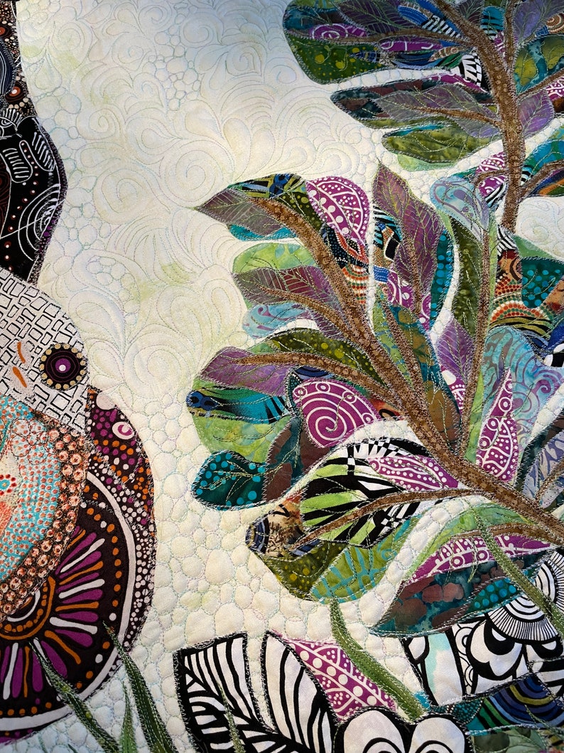 May include: A close-up of a colorful quilt with a floral design. The quilt is made of different fabrics and textures, and the flowers are stitched together with intricate detail. The quilt is a beautiful example of handmade art.