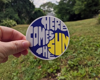 Aquí viene el sol, The Beatles, letras de canciones, pegatinas para portátiles, parachoques, carpetas y botellas de agua