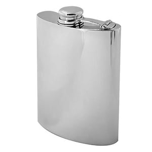 May include: A polished, stainless steel flask with a rounded rectangular shape. The flask has a screw-on cap and a hinged closure. The surface is highly reflective, giving it a mirror-like appearance. The flask is designed to hold liquids.