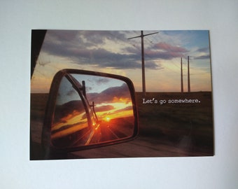 Let's Go Somewhere postcard, 5x7 inch with sunset roadtrip photo