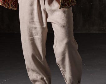 Pantalones holgados de lino para hombre con cintura elástica y estilo playero bohemio.