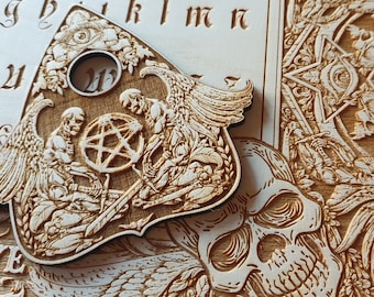 Ouija board with demons and skulls wooden engraving, wood gothic skull spirit board.
