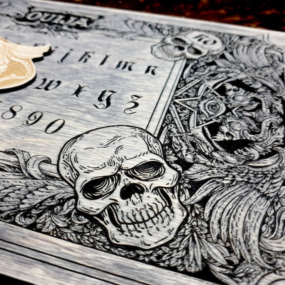 Ouija board with planchette for spiritualism, demons and skulls wooden engraving dark , wood gothic skull spirit board in vintage look