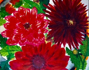 Study on reds: A heady plate of red dahlia flowers