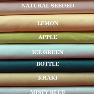 May include: A collection of fabric swatches in various colors, including cream, natural seeded, lemon, apple, ice green, bottle, khaki, misty blue, and emerald.