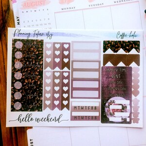 May include: A sticker sheet featuring coffee-themed planner elements, including circular day-of-the-week labels, heart-shaped flags, rectangular boxes, and a list with text reading Family Time, Rent, Pay Day, Laundry Day, Date Night, Bill Due, and Total.