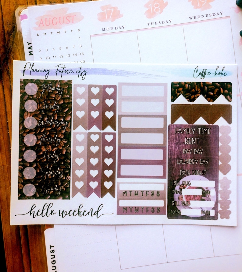 May include: A sticker sheet featuring coffee-themed planner elements, including circular day-of-the-week labels, heart-shaped flags, rectangular boxes, and a list with text reading Family Time, Rent, Pay Day, Laundry Day, Date Night, Bill Due, and Total.