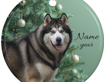 May include: Circular Christmas decoration with a Siberian Husky dog against a festive backdrop. The dog has a black and white coat and blue eyes. The ornament has the text "Name year". A gold string is attached for hanging.