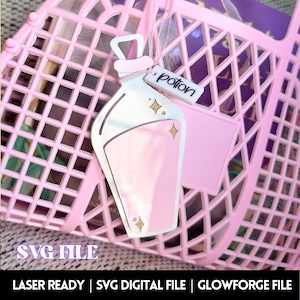 May include: Pink plastic shopping bag with a pink and silver potion bottle charm with a gold glitter design and a white tag that says "potion".