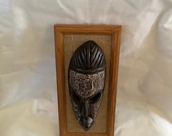 Framed Metal Face Mask With Gyename Symbol for Wall