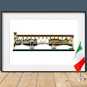 Puede incluir: Una impresión enmarcada de una ilustración detallada del Ponte Vecchio en Florencia, Italia. El puente se representa con múltiples tiendas y edificios que bordean ambos lados. Una pequeña bandera italiana se muestra en un soporte en primer plano.
