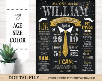 May include: A black chalkboard-style birthday milestone poster for William, featuring gold glitter accents, a top hat, mustache, and tie graphic. It displays text including I LOVE, MY FAVES, I AM, and I CAN, with details like 26 inches and 19 pounds.