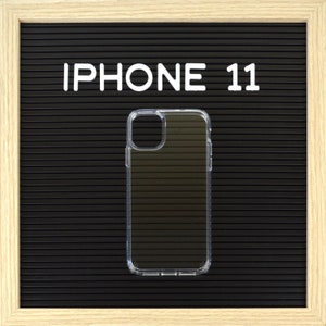 May include: Clear iPhone 11 phone case on a black background with the text "IPHONE 11" in white letters. The case is transparent and has a ridged design on the back.