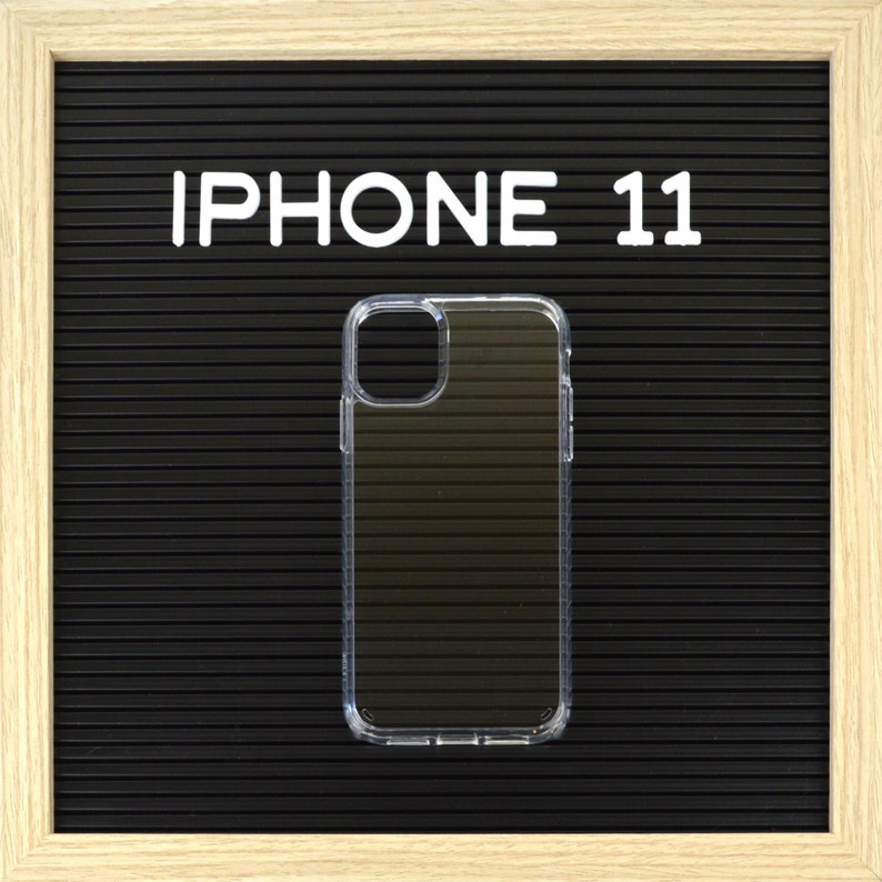 May include: Clear iPhone 11 phone case on a black background with the text "IPHONE 11" in white letters. The case is transparent and has a ridged design on the back.