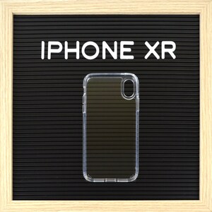 May include: Clear iPhone XR phone case on a black background with the text "IPHONE XR" in white letters. The case is transparent and has a sleek, modern design, offering protection while showcasing the phone's original look.