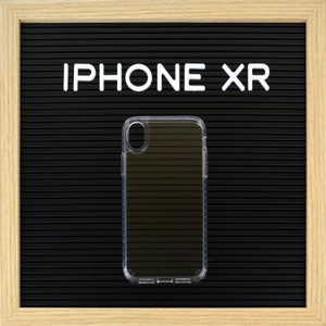 May include: Clear protective phone case for an iPhone XR. The case is transparent, allowing the phone's design to show through. The phone case is on a black background with the words "IPHONE XR" in white letters.